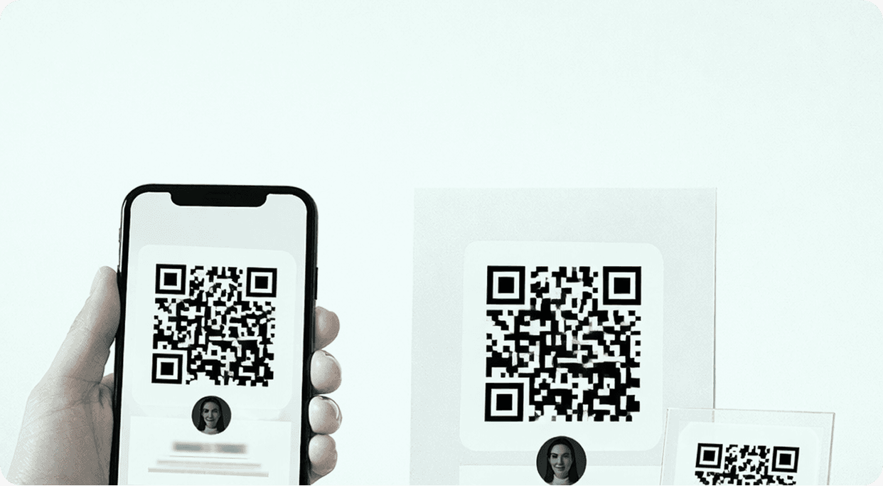 Phone and printed card showing QR code
